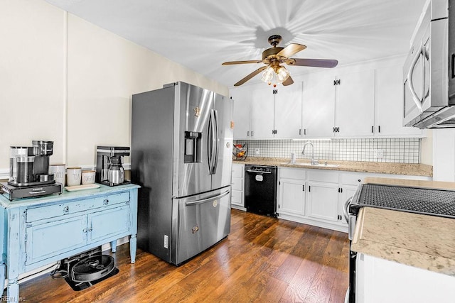 kitchen featuring stainless steel appliances, ceiling fan, decorative backsplash, white cabinetry, and dark wood-style floors