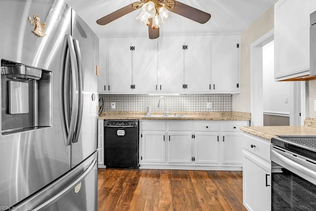 kitchen featuring appliances with stainless steel finishes, a sink, ceiling fan, dark wood finished floors, and white cabinets