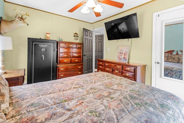 bedroom with ceiling fan and crown molding