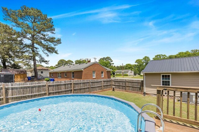 view of pool with a residential view