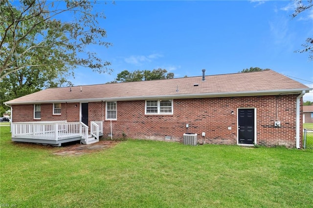 3609 Ithaca Trl, Suffolk, VA 23435 - rear view of property with a deck, central air condition unit, a lawn, and brick siding