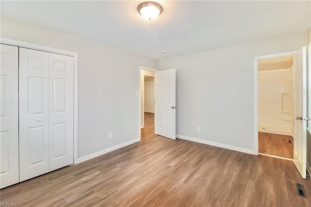 3609 Ithaca Trl, Suffolk, VA 23435 - unfurnished bedroom with wood finished floors, baseboards, and a closet
