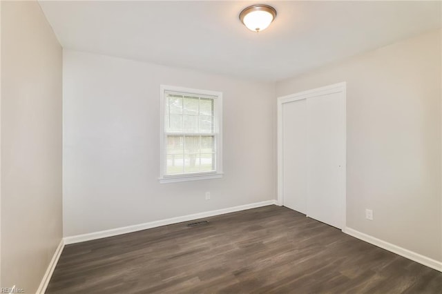 3609 Ithaca Trl, Suffolk, VA 23435 - spare room with dark wood-style flooring and baseboards