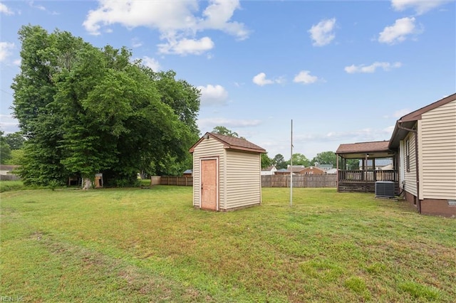 7103 Orcutt Ave, Newport News, VA 23605 - view of yard featuring a storage unit, central AC, and an outdoor structure