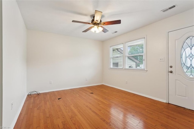 7103 Orcutt Ave, Newport News, VA 23605 - foyer entrance with ceiling fan, light wood-style floors, and baseboards
