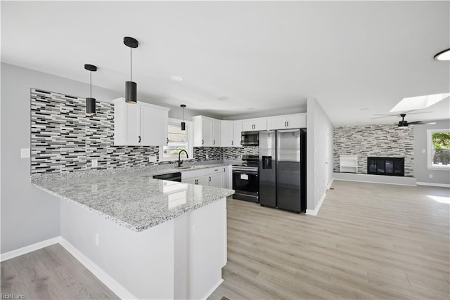 808 Williams Ave, Chesapeake, VA 23323 - kitchen with appliances with stainless steel finishes, a peninsula, decorative backsplash, and baseboards