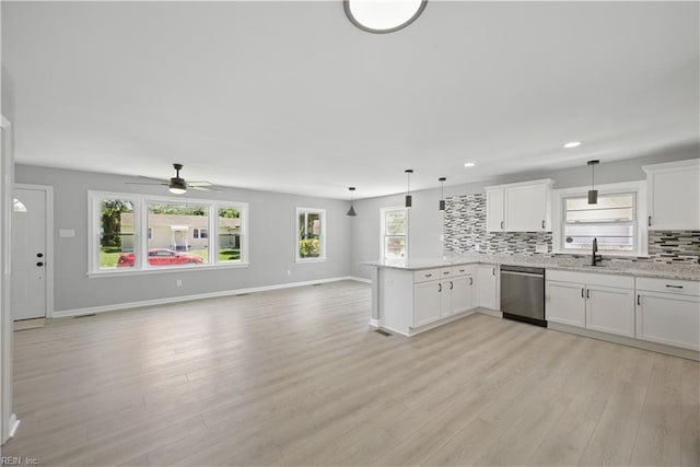 808 Williams Ave, Chesapeake, VA 23323 - kitchen featuring dishwasher, a peninsula, open floor plan, decorative backsplash, and light wood finished floors
