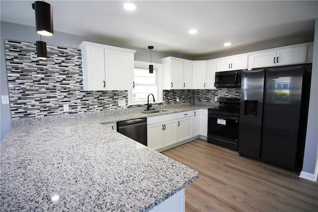 808 Williams Ave, Chesapeake, VA 23323 - kitchen featuring black appliances, a sink, decorative backsplash, light stone countertops, and recessed lighting
