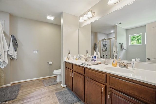 105 Christophers Ln, Hampton, VA 23666 - full bath with wood finished floors, a stall shower, toilet, double vanity, and baseboards