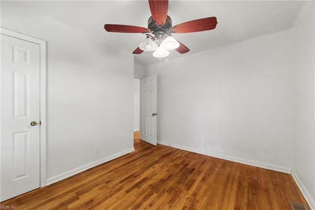 7811 Nesbitt Dr, Norfolk, VA 23505 - unfurnished room with baseboards, wood finished floors, and a ceiling fan
