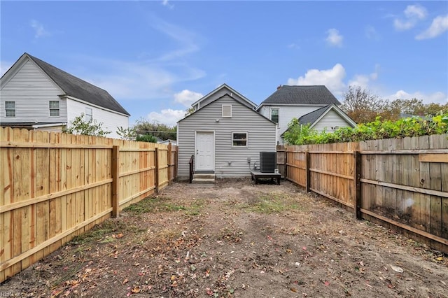 1233 25th St, Newport News, VA 23607 - rear view of house featuring entry steps, central AC unit, and a fenced backyard