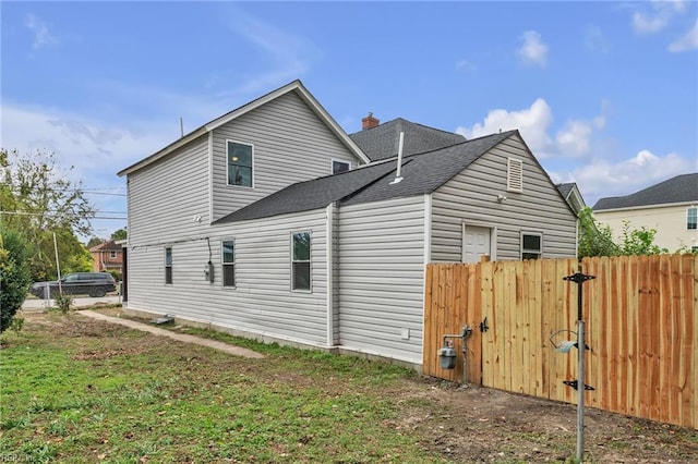1233 25th St, Newport News, VA 23607 - view of property exterior with roof with shingles and a chimney