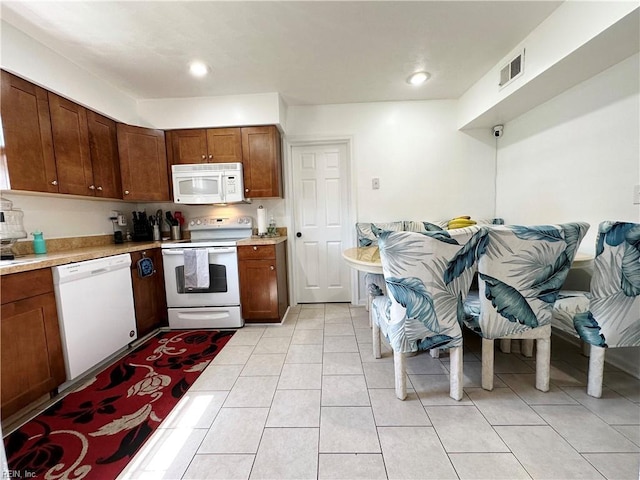 1248 Gladiola Cres, Virginia Beach, VA 23453 - kitchen featuring white appliances, light countertops, light tile patterned flooring, and recessed lighting