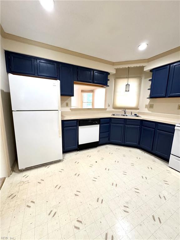 121 Monarch Glade, Yorktown, VA 23692 - kitchen with white appliances, blue cabinetry, a sink, light countertops, and crown molding