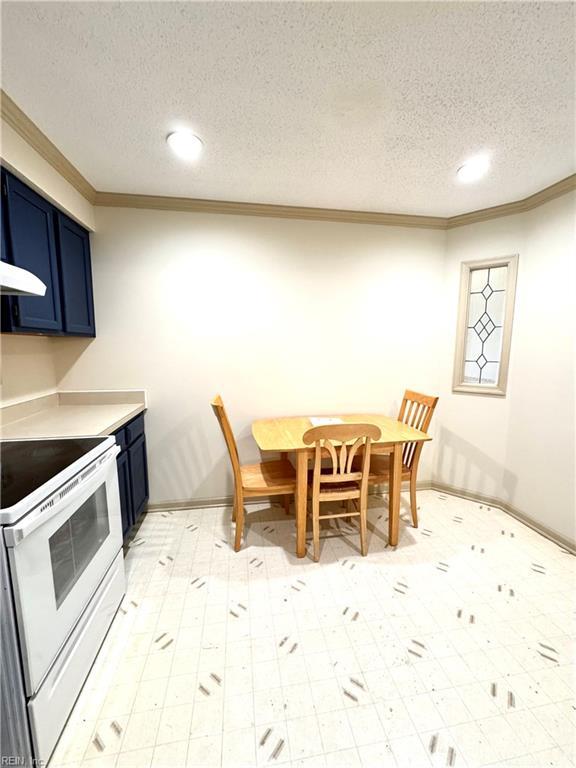 121 Monarch Glade, Yorktown, VA 23692 - dining room with crown molding, recessed lighting, a textured ceiling, and light floors