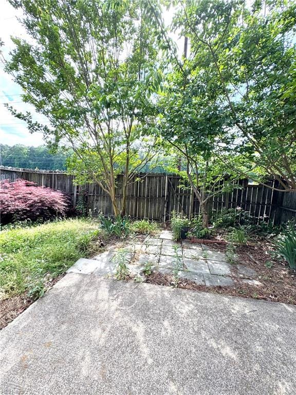 121 Monarch Glade, Yorktown, VA 23692 - fenced backyard featuring a patio