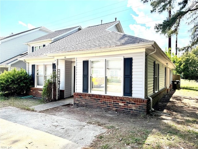 121 Monarch Glade, Yorktown, VA 23692 - view of front of house featuring a shingled roof and brick siding