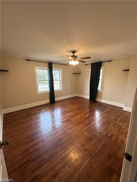 1355 W Norcova Dr, Norfolk, VA 23502 - empty room with a ceiling fan, dark wood finished floors, crown molding, and baseboards