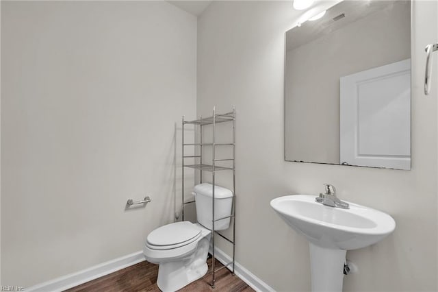 122 American Way, Suffolk, VA 23434 - bathroom with wood finished floors, baseboards, and toilet