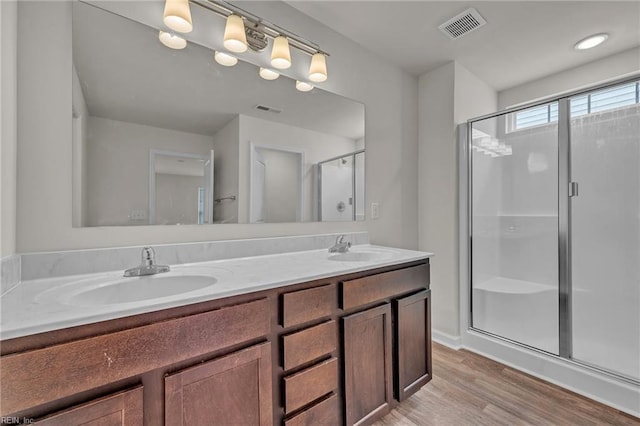122 American Way, Suffolk, VA 23434 - full bathroom featuring wood finished floors, a stall shower, and double vanity