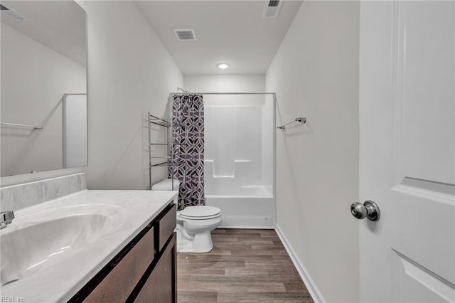 122 American Way, Suffolk, VA 23434 - bathroom with wood finished floors, toilet, vanity, shower / tub combo, and baseboards