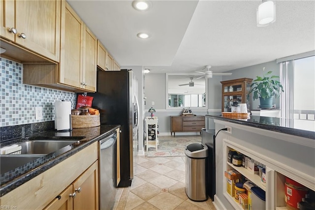 1222 E Ocean View Ave Unit 302, Norfolk, VA 23503 - kitchen with dishwasher, a ceiling fan, decorative backsplash, dark stone countertops, and recessed lighting