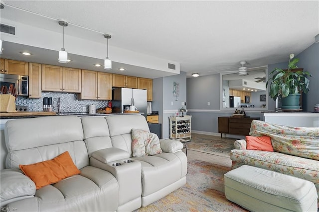 1222 E Ocean View Ave Unit 302, Norfolk, VA 23503 - living room featuring ceiling fan, baseboards, and recessed lighting