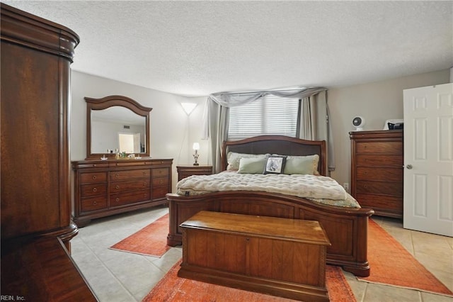 1222 E Ocean View Ave Unit 302, Norfolk, VA 23503 - bedroom featuring light tile patterned floors and a textured ceiling