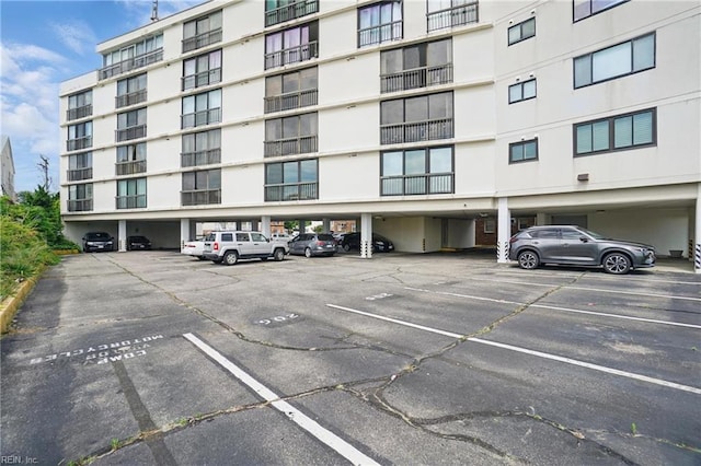 1222 E Ocean View Ave Unit 302, Norfolk, VA 23503 - view of apartment building / complex with covered and uncovered parking
