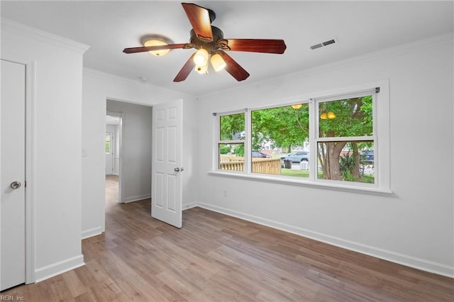 669 Kenneth Rd, Virginia Beach, VA 23462 - unfurnished bedroom featuring baseboards, light wood-style flooring, ornamental molding, and a ceiling fan