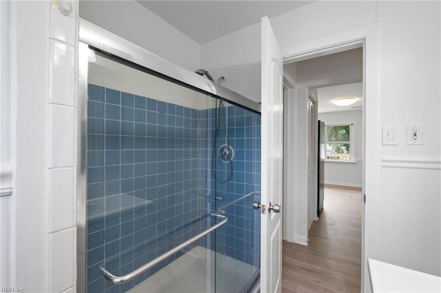 669 Kenneth Rd, Virginia Beach, VA 23462 - bathroom featuring a stall shower, wood finished floors, and baseboards