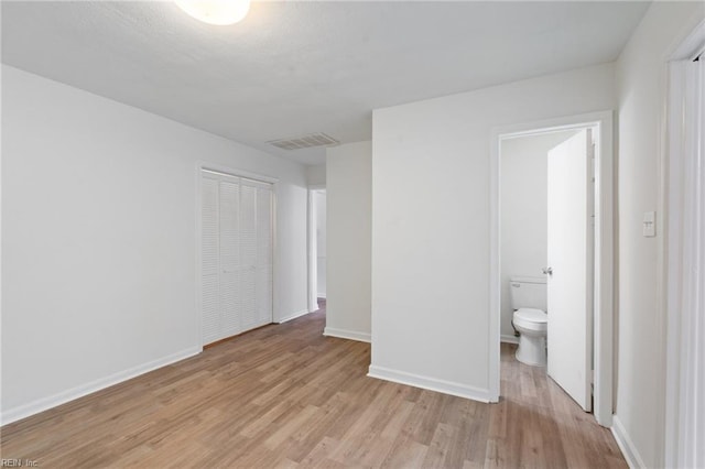 669 Kenneth Rd, Virginia Beach, VA 23462 - unfurnished bedroom featuring light wood-style floors, baseboards, and a closet