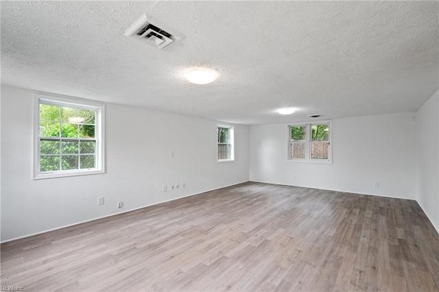 669 Kenneth Rd, Virginia Beach, VA 23462 - empty room featuring a textured ceiling and wood finished floors