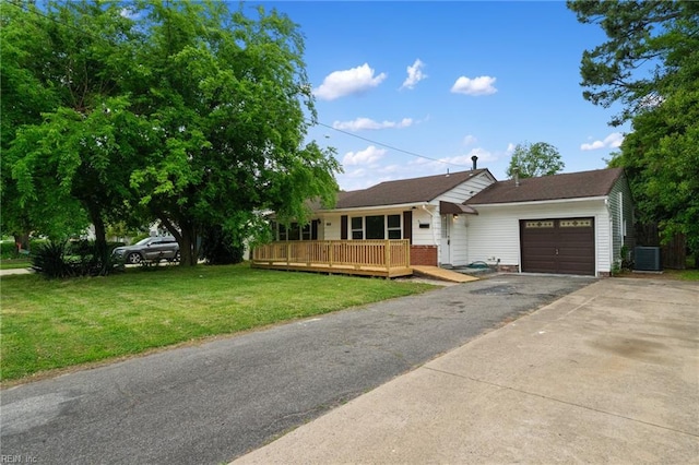 669 Kenneth Rd, Virginia Beach, VA 23462 - ranch-style home with a garage, driveway, a front lawn, a wooden deck, and central AC unit