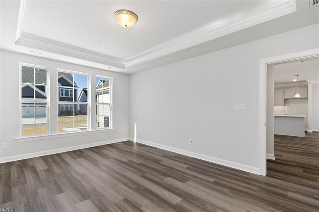 2237 Sanibel Ln, Chesapeake, VA 23321 - empty room with a tray ceiling, crown molding, dark wood finished floors, and baseboards