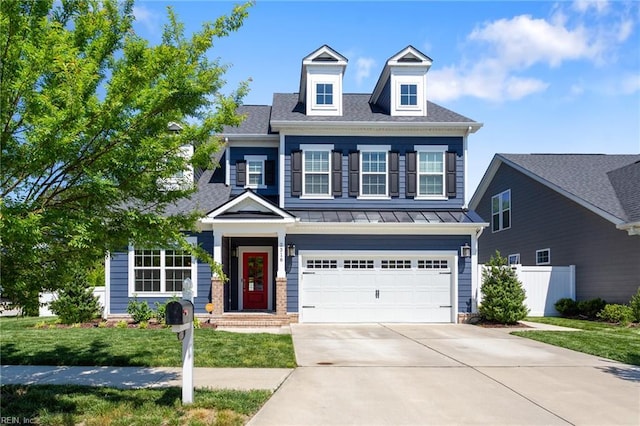 2316 William D Lee Ct, Virginia Beach, VA 23456 - view of front of property with driveway, a standing seam roof, an attached garage, metal roof, and a shingled roof
