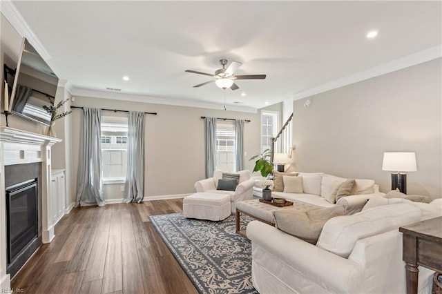 2316 William D Lee Ct, Virginia Beach, VA 23456 - living room featuring ceiling fan, a glass covered fireplace, dark wood-style floors, plenty of natural light, and crown molding