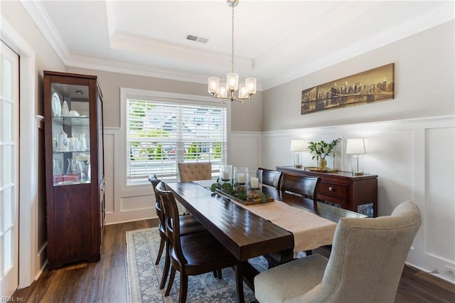 2316 William D Lee Ct, Virginia Beach, VA 23456 - dining area with a tray ceiling, a decorative wall, a chandelier, crown molding, and dark wood-style flooring