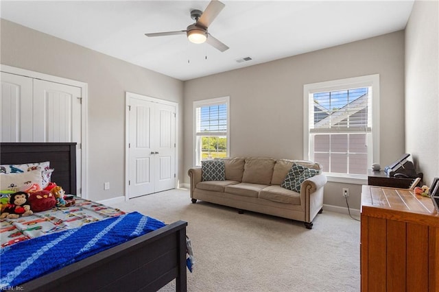 2316 William D Lee Ct, Virginia Beach, VA 23456 - bedroom featuring light colored carpet, baseboards, ceiling fan, and two closets