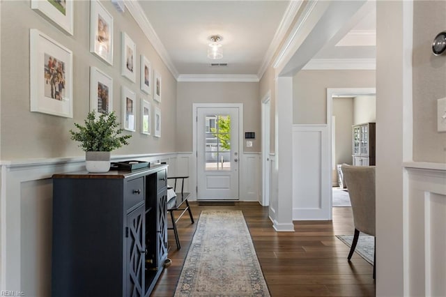 2316 William D Lee Ct, Virginia Beach, VA 23456 - entrance foyer featuring dark wood-type flooring, a wainscoted wall, crown molding, and a decorative wall