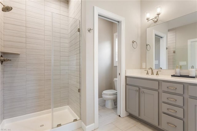 2316 William D Lee Ct, Virginia Beach, VA 23456 - bathroom with a shower stall, toilet, vanity, baseboards, and tile patterned floors