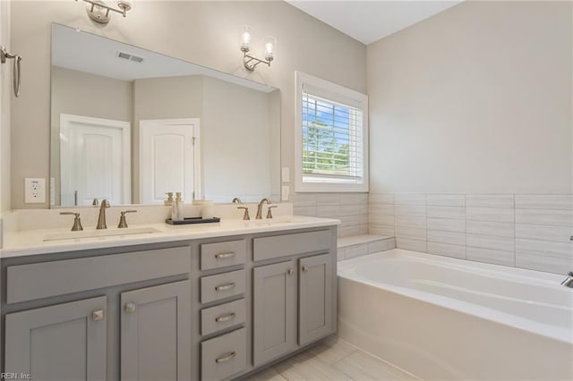 2316 William D Lee Ct, Virginia Beach, VA 23456 - bathroom with a bath and double vanity