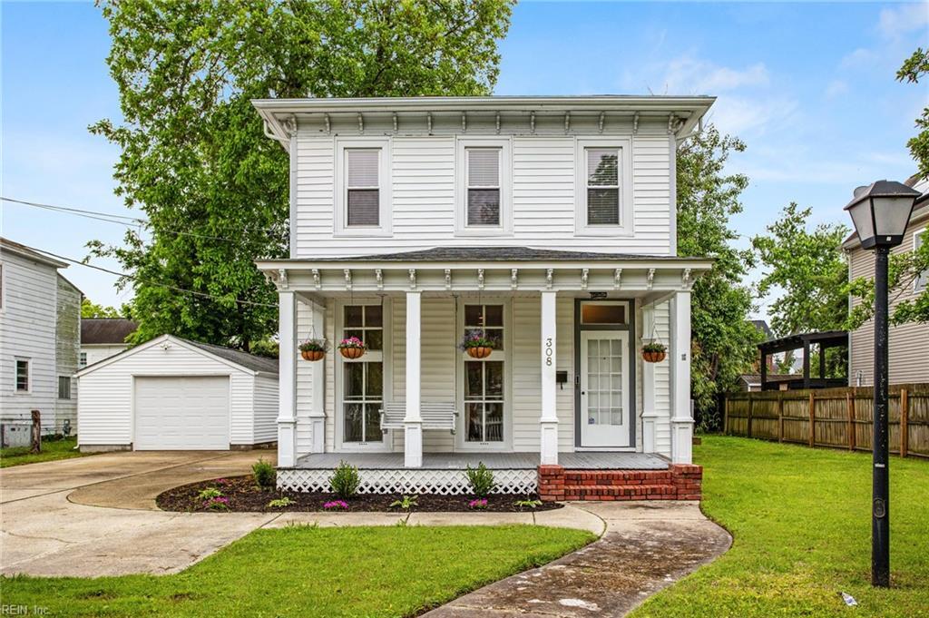 308 E Pembroke Ave, Hampton, VA 23669 - italianate house with covered porch, an outdoor structure, driveway, and a detached garage