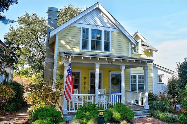 9527 24th Bay St, Norfolk, VA 23518 - view of front of house featuring a porch and a chimney