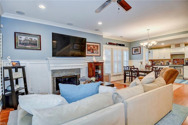 9527 24th Bay St, Norfolk, VA 23518 - living room with a ceiling fan, ornamental molding, a wainscoted wall, light wood-style floors, and a premium fireplace