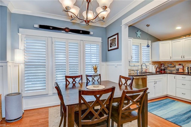 9527 24th Bay St, Norfolk, VA 23518 - dining area featuring light wood-style floors, wainscoting, plenty of natural light, a chandelier, and crown molding