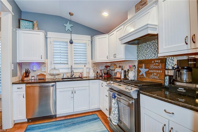 9527 24th Bay St, Norfolk, VA 23518 - kitchen with appliances with stainless steel finishes, a sink, premium range hood, vaulted ceiling, and light wood-style flooring