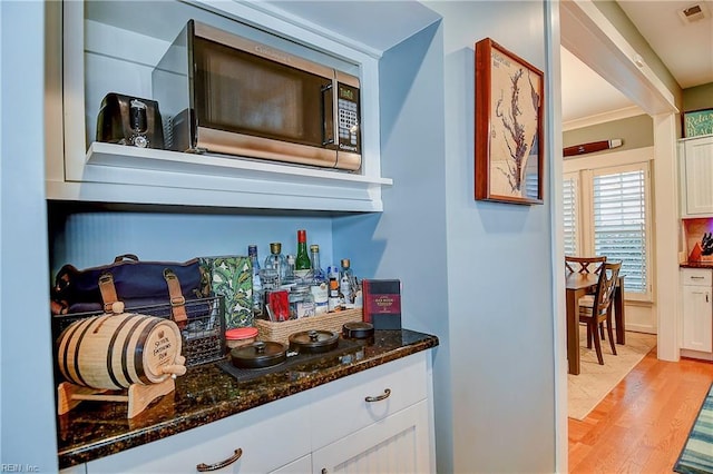 9527 24th Bay St, Norfolk, VA 23518 - indoor dry bar with stainless steel microwave and light wood-style floors
