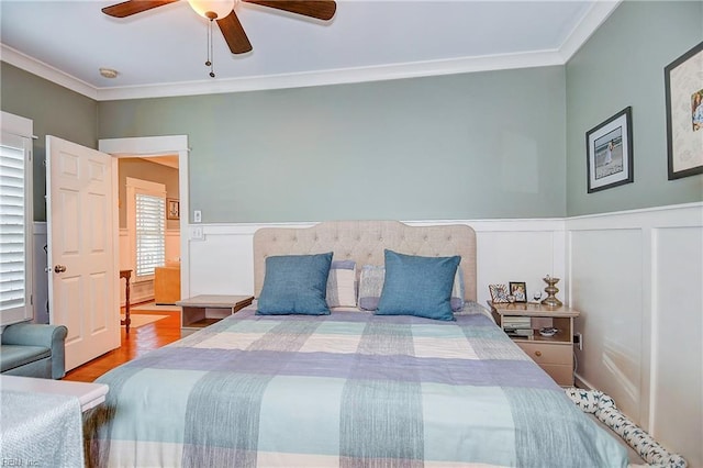9527 24th Bay St, Norfolk, VA 23518 - bedroom featuring ornamental molding, a decorative wall, wood finished floors, a wainscoted wall, and ceiling fan