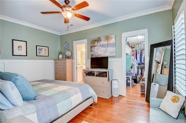 9527 24th Bay St, Norfolk, VA 23518 - bedroom featuring a spacious closet, a closet, ornamental molding, wood finished floors, and wainscoting